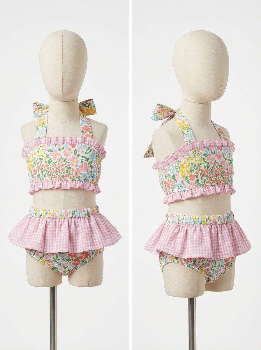 Girls floral two-piece swim set, pink ruffled bandeau top with bow straps and skirt