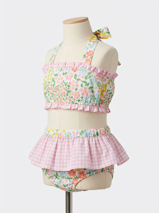 Girls floral two-piece swim set with pink ruffled top and skirted bikini bottoms