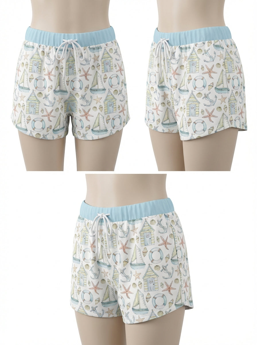 Boys swim shorts with nautical pattern, light blue waistband, tie front and back view