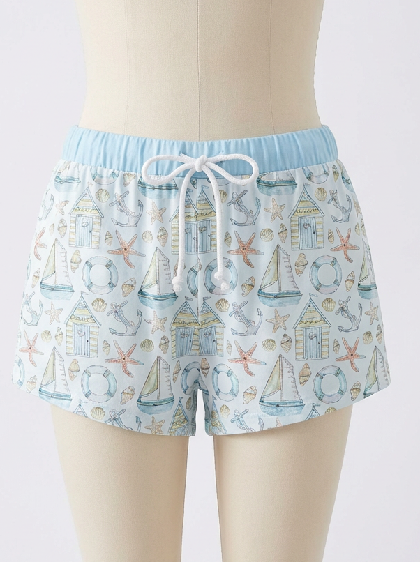 Boys swim shorts with light blue drawstring waistband and nautical print, front view