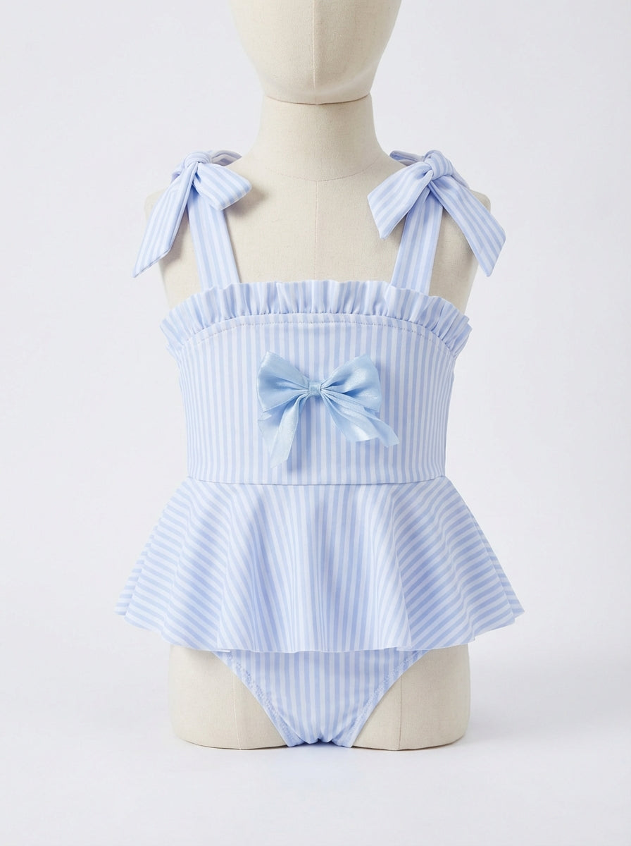 Girls striped ruffle swim one-piece with bow ties and gathered neckline, light blue.