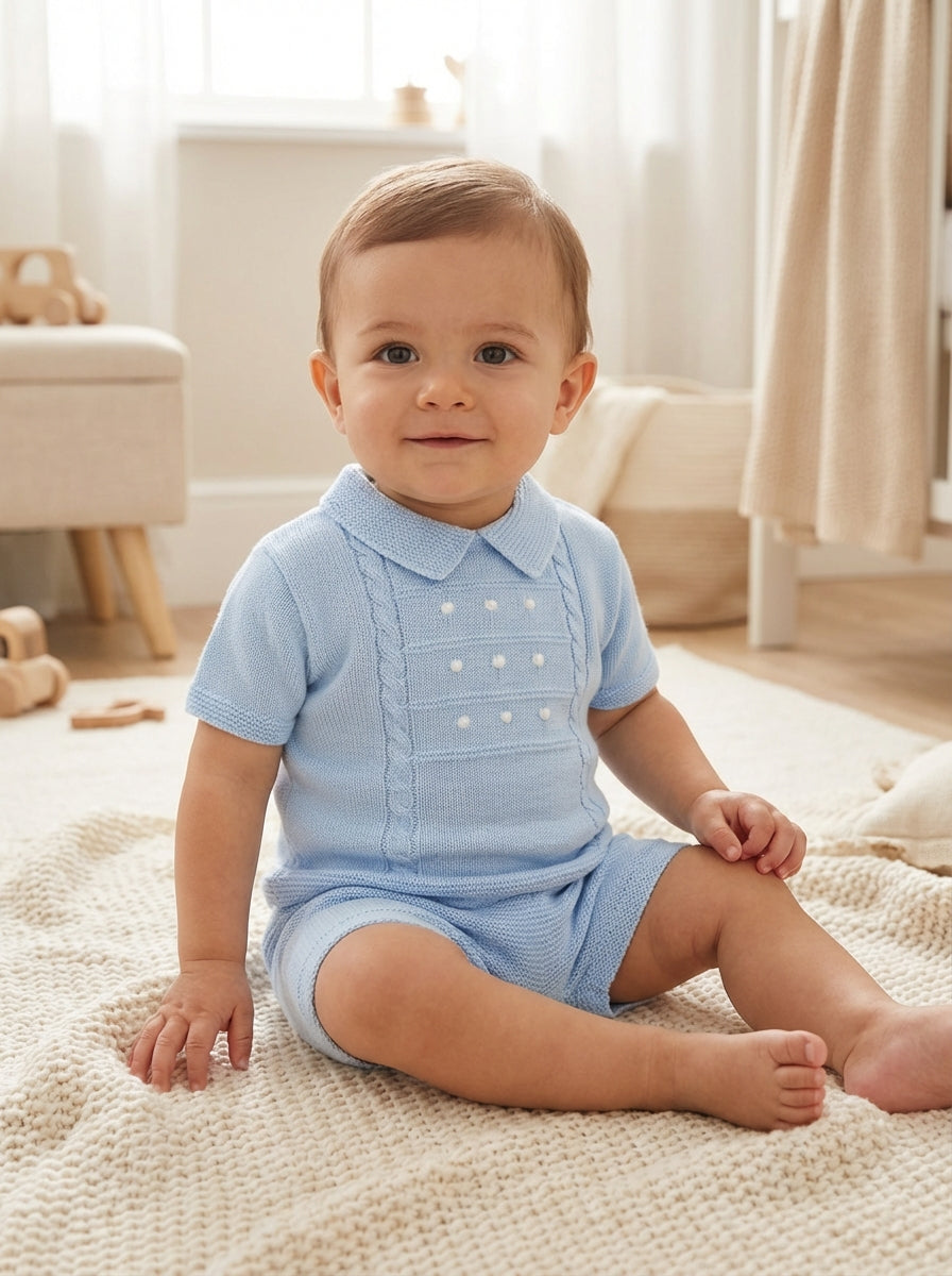 Blue boy’s shorts suit set with cable-knit polo top and white dot placket