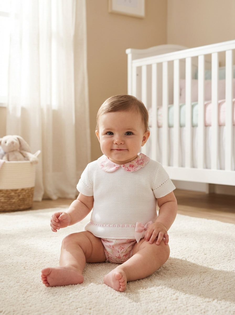 Girls’ white knit top with pink floral collar and matching floral shorts