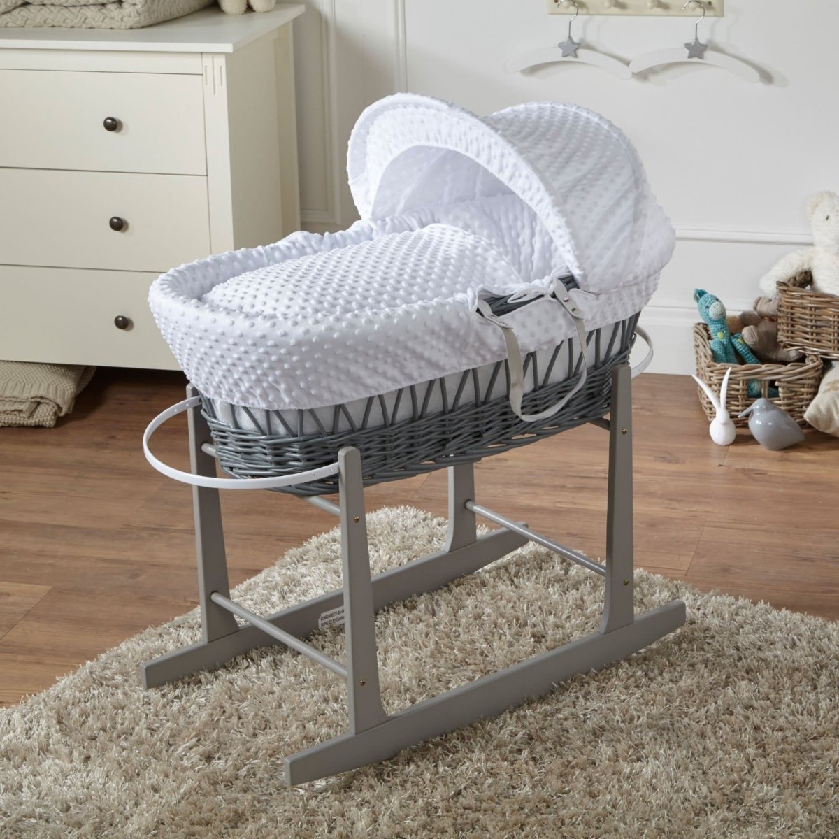 Wicker Moses basket with stand, white padded bedding and hooded cover