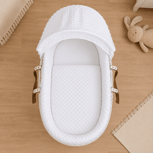 White Moses basket bedding set with padded cover and curved hood