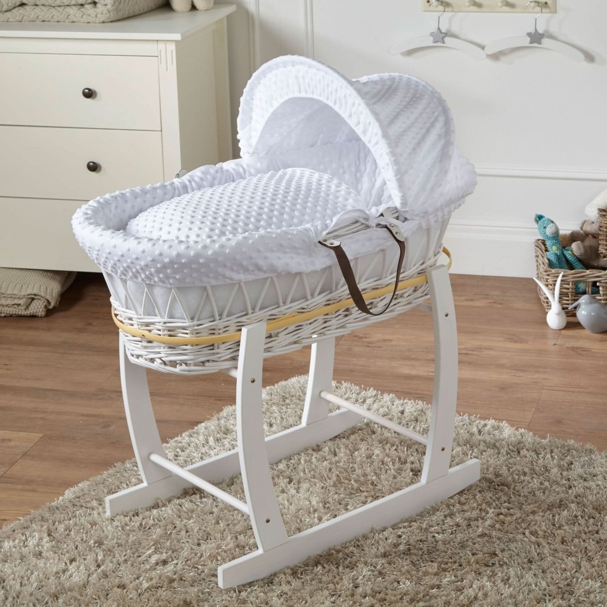White wicker Moses basket with stand, white padded mattress and hooded lining