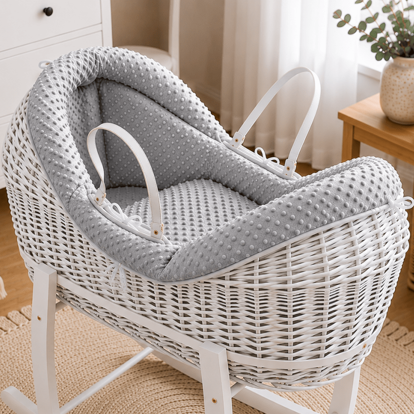 Grey wicker moses basket with grey padded waffle liner and carrying handles