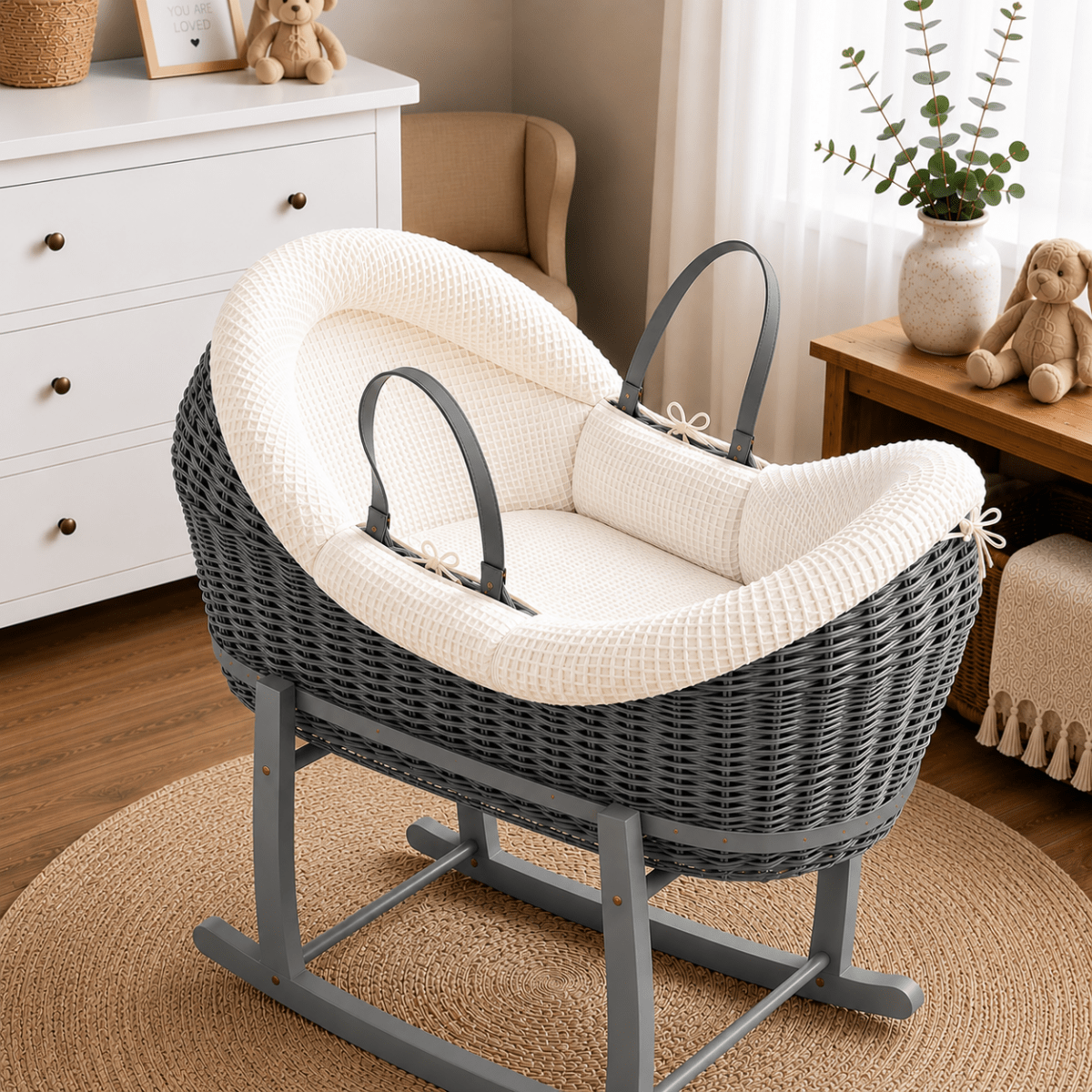 Wicker Moses basket with stand, white textured bedding and curved hood