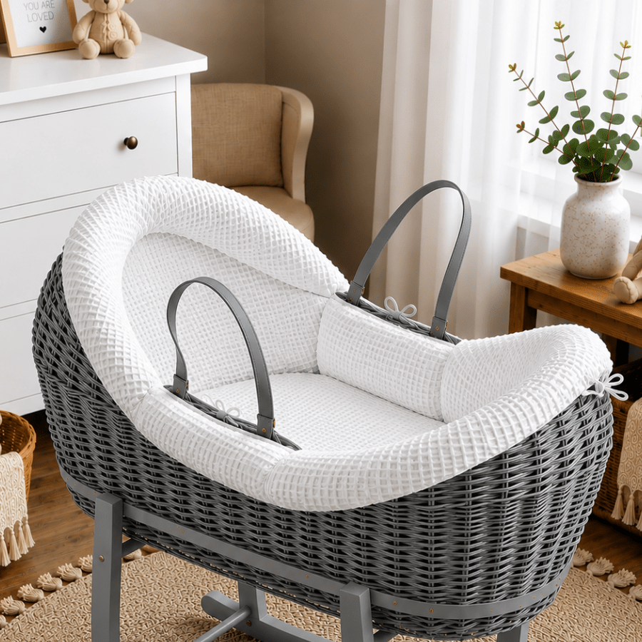 Wicker moses basket with white textured carrycot insert and dark-gray handle straps