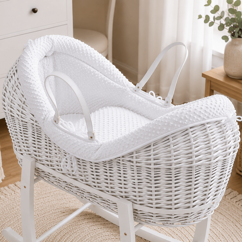 Wicker moses basket with white textured carrycot insert and white handle straps