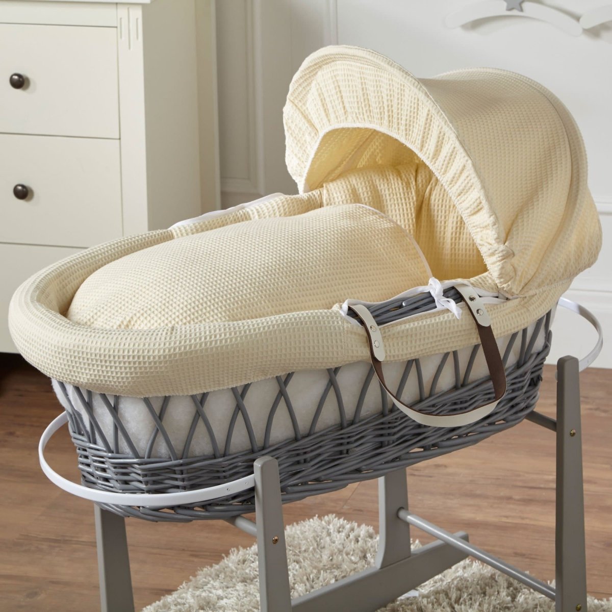 Wicker Moses basket with cream waffle bedding and white frame, no stand